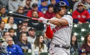 Boston Red Sox third baseman Rafael Devers hits a home run