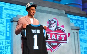 Bryce Young holding jersey during NFL Draft