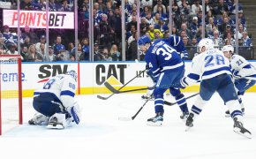 Toronto Maple Leafs center Auston Matthews battles with Tampa Bay Lightning defenseman Ian Cole