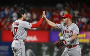 Los Angeles Angels starting pitcher Shohei Ohtani high-fives center fielder Mike Trout
