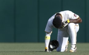 Pittsburgh Pirates designated hitter Andrew McCutchen taking a knee