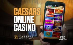 Caesars online casino hand holding mobile phone with games