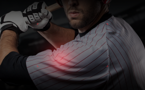 Baseball player holding bat white jersey red stripes