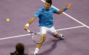 Djokovic returning a ball in Qatar.