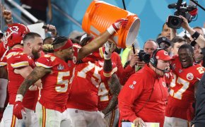 Kansas City Chiefs outside linebacker Damien Wilson (54), Chiefs tight end Travis Kelce (87), and Chiefs offensive tackle Cameron Erving (75) celebrate by dumping Gatorade on Chiefs head coach Andy Reid