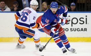 New York Rangers left wing Artemi Panarin controls the puck against New York Islanders right wing Oliver Wahlstrom
