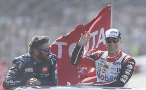 NASCAR Cup Series drivers Kevin Harvick and Martin Truex Jr wave to fans