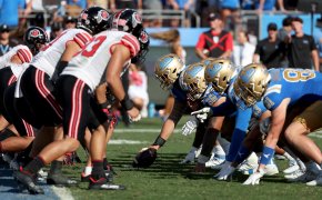 The UCLA Bruins offensive line on the line of scrimmage against the Utah Utes