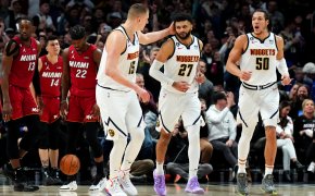 Nuggets celebrate in front of Miami Heat players