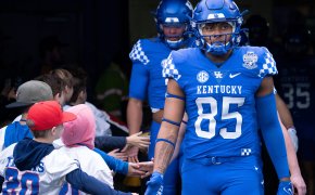 Kentucky tight end Jordan Dingle takes the field with teammates