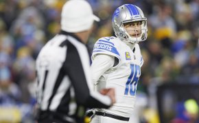 Detroit Lions quarterback Jared Goff talks to an official