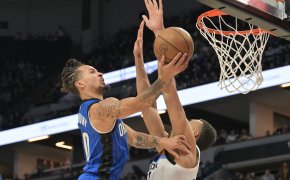 Orlando guard Cole Anthony goes for a layup against Minnesota center Rudy Gobert