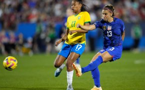 United States forward Alex Morgan (13) takes a shot at goal against Brazil midfielder Ary Borges