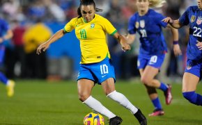 Brazil forward Marta (10) dribbles the ball against United States of America