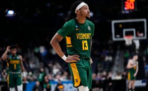 Vermont Catamounts college basketball player Dylan Penn green jersey