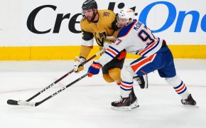 Edmonton Oilers center Connor McDavid battles for position against Vegas Golden Knights right wing Michael Amadio