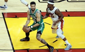 Boston Celtics forward Jayson Tatum backing down Miami Heat forward Jimmy Butler