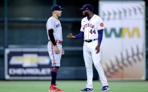Minnesota Twins shortstop Carlos Correa talks with Houston Astros designated hitter Yordan Alvarez