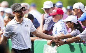 Patrick Rodgers slaps hands with fans at the Memorial Tournament.