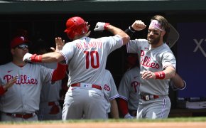 Philadelphia Phillies players celebrate a home run in the dugout