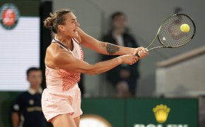 Aryna Sabalenka smashes a return in French Open play