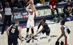 Miami Heat guard Duncan Robinson facing Denver Nuggets defenders in the NBA Finals.
