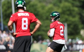 New York Jets quarterback Zach Wilson (2) participates in drills in front of quarterback Aaron Rodgers (8) during the New York Jets Training Camp