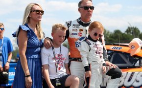 NASCAR Cup Series driver Kevin Harvick stands with family