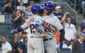 Pete Alonso celebrates a home run with Francisco Lindor.