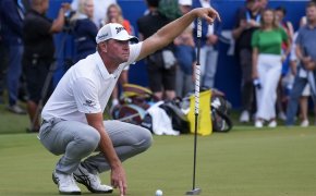 Lucas Glover lines up a putt at the Wyndham Championship.