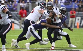 Houston Texans quarterback C.J. Stroud getting sacked by the Baltimore Ravens