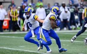 Los Angeles Rams quarterback Matthew Stafford hands the ball off to running back Cam Akers
