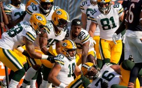 Green Bay Packers quarterback Jordan Love is surrounded by teammates