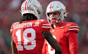 Ohio State Buckeyes wide receiver Marvin Harrison Jr celebrates with quarterback Kyle McCord