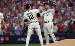 Minnesota Twins third baseman Kyle Farmer and first baseman Donovan Solano celebrate a win