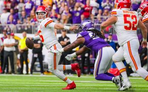 Kansas City Chiefs quarterback Patrick Mahomes (15) scrambles against the Minnesota Vikings