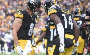 Pittsburgh Steelers quarterback Kenny Pickett (8) celebrates a game-winning touchdown with wide receiver George Pickens (14)