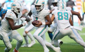 Miami Dolphins quarterback Tua Tagovailoa faking a handoff