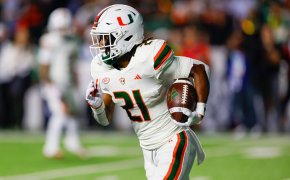Miami Hurricanes running back Henry Parrish Jr. carries the football