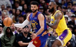 Denver Nuggets guard Jamal Murray controls the ball as Los Angeles Lakers forward LeBron James