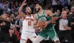 Boston Celtics forward Jayson Tatum is guarded by New York Knicks guard Jalen Brunson