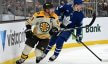 Boston Bruins left wing Brad Marchand skates against Toronto Maple Leafs defenseman Morgan Rielly