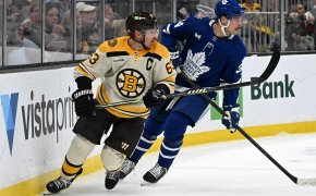 Boston Bruins left wing Brad Marchand skates against Toronto Maple Leafs defenseman Morgan Rielly
