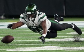 New York Jets running back Breece Hall dives after a fumble