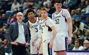 UConn coach Dan Hurley talking to his players on the sideline