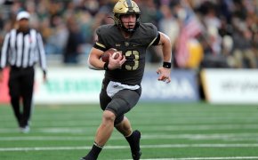 Army Black Knights quarterback Bryson Daily (13) carries the ball