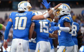 Los Angeles Chargers quarterback Justin Herbert celebrates a TD with tight end Stone Smartt
