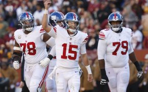 New York Giants quarterback Tommy DeVito (15) celebrates after throwing a touchdown pass