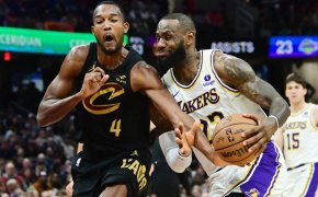 Cleveland Cavaliers forward Evan Mobley fouls Los Angeles Lakers forward LeBron James