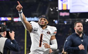 Chicago Bears quarterback Justin Fields (1) runs off the field after the game